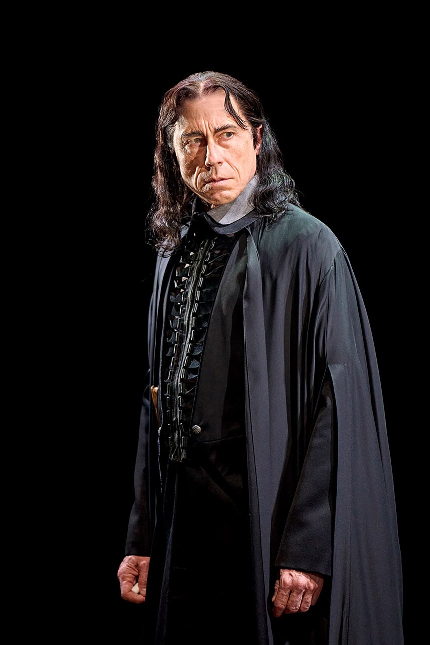 David Annen as Severus Snape, wearing a dark robe, looking intently to the side.