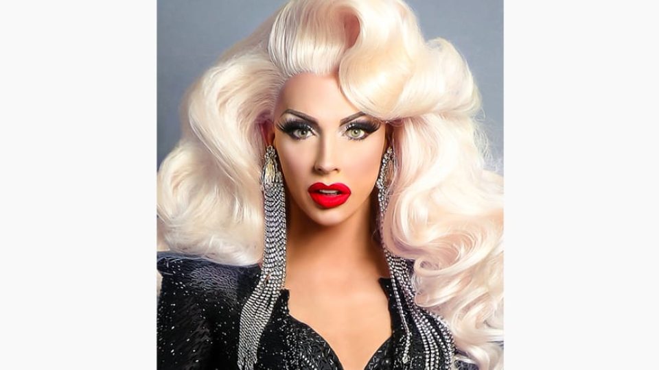 Alyssa Edwards features voluminous blonde hair and red lips, wearing a sparkling black outfit.