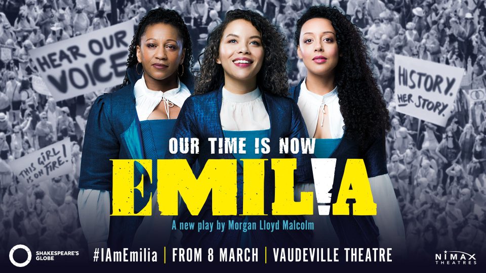 Three women in elegant costumes stand confidently, with protest signs visible in the background.