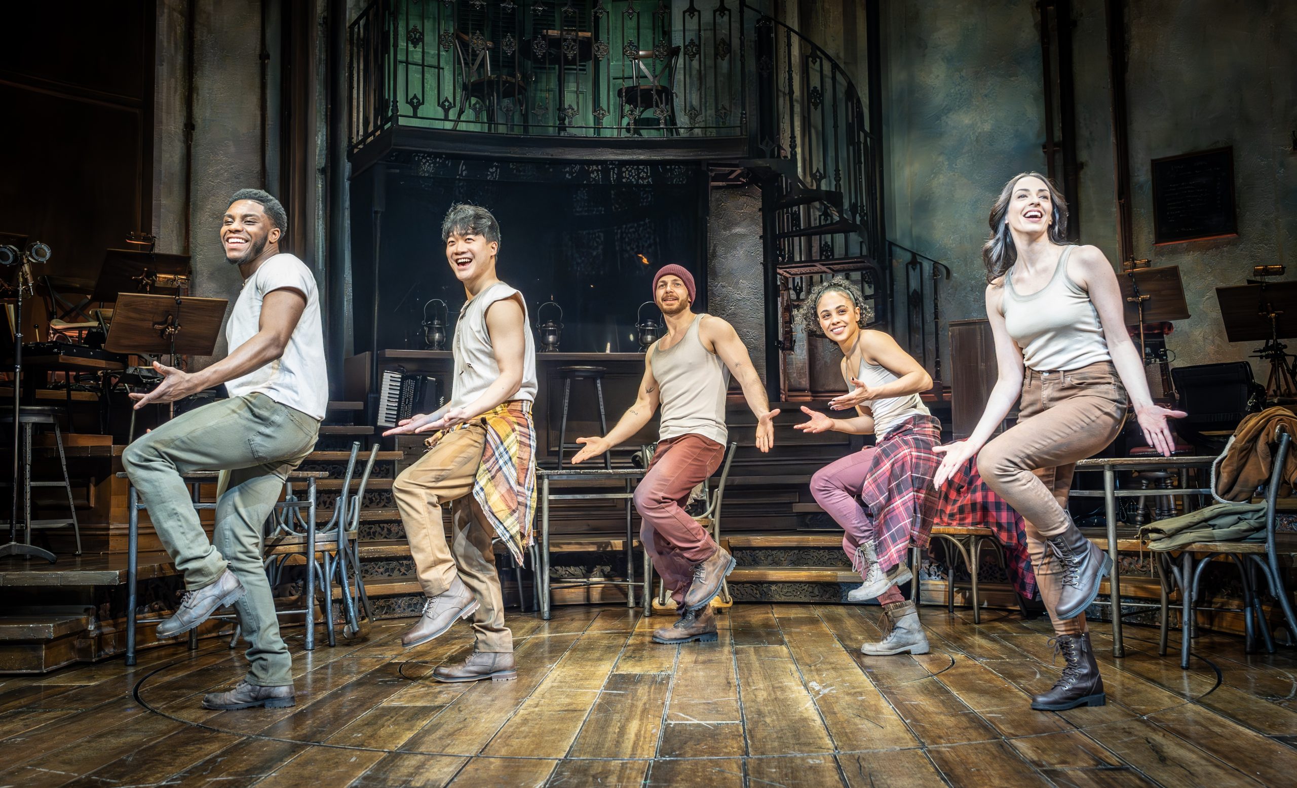 Five cast members in Hadestown dance on stage