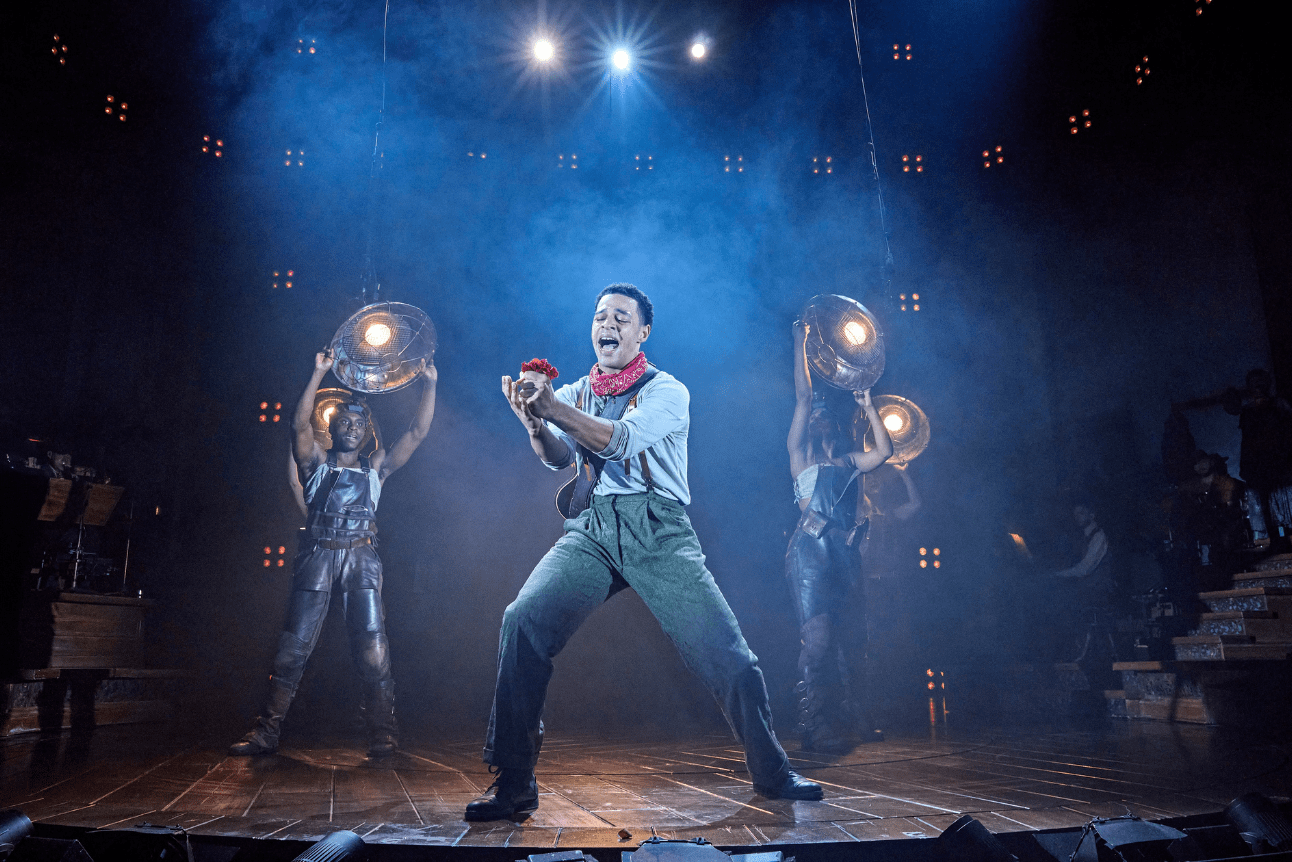 Orpheus sings out passionately while holding out a bright red flower