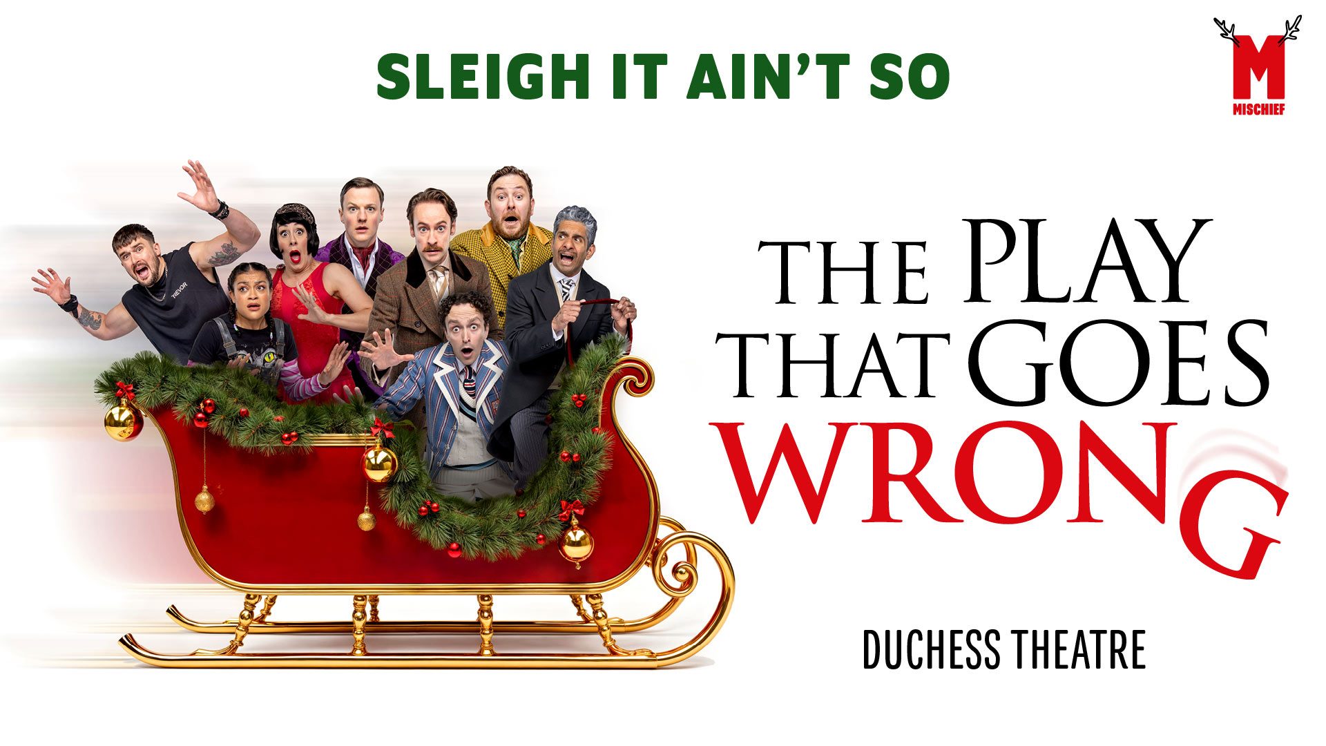 Seven actors in festive Victorian-style costumes pose inside a red sleigh prop against a white background.