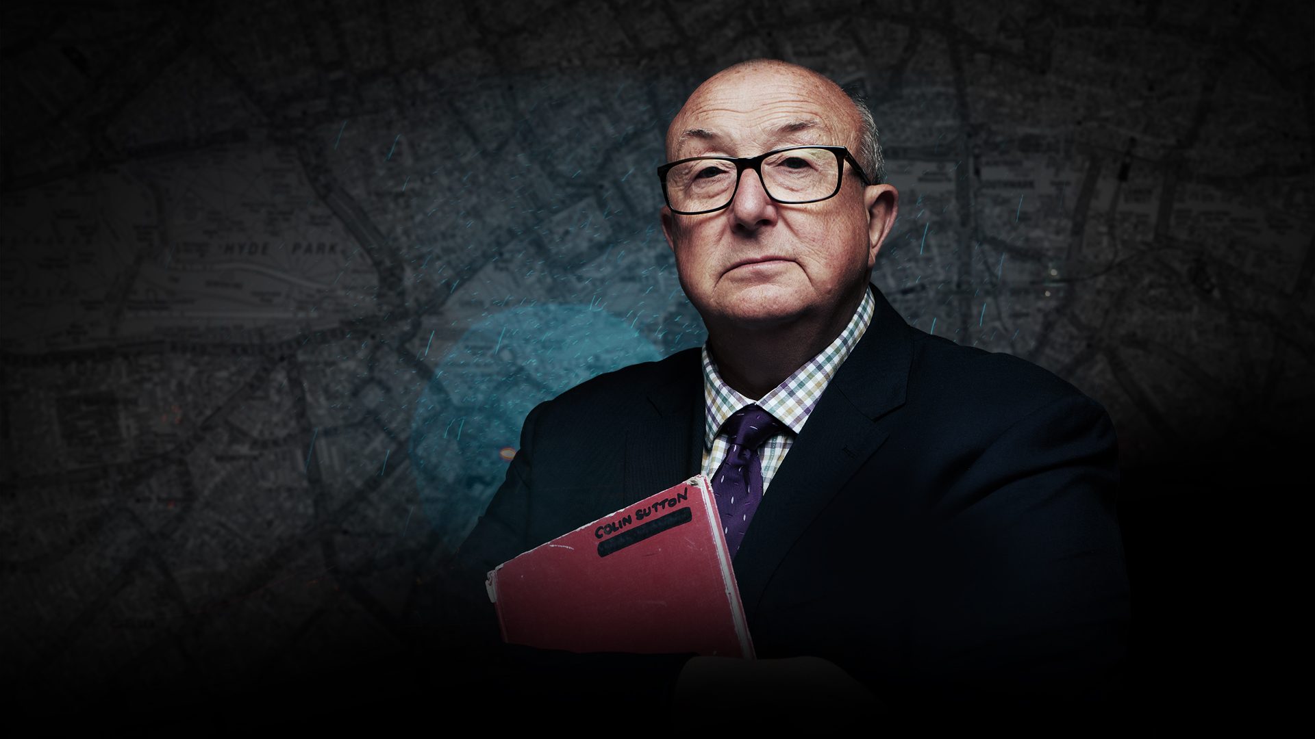 Man in glasses holding a red file, with a dark map background.