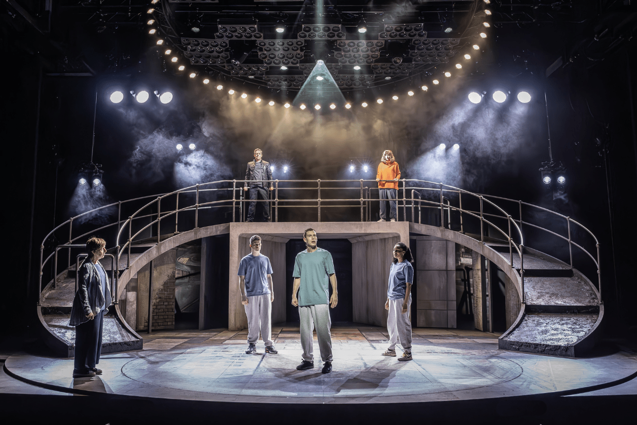 Punch actors on split level stage looking out