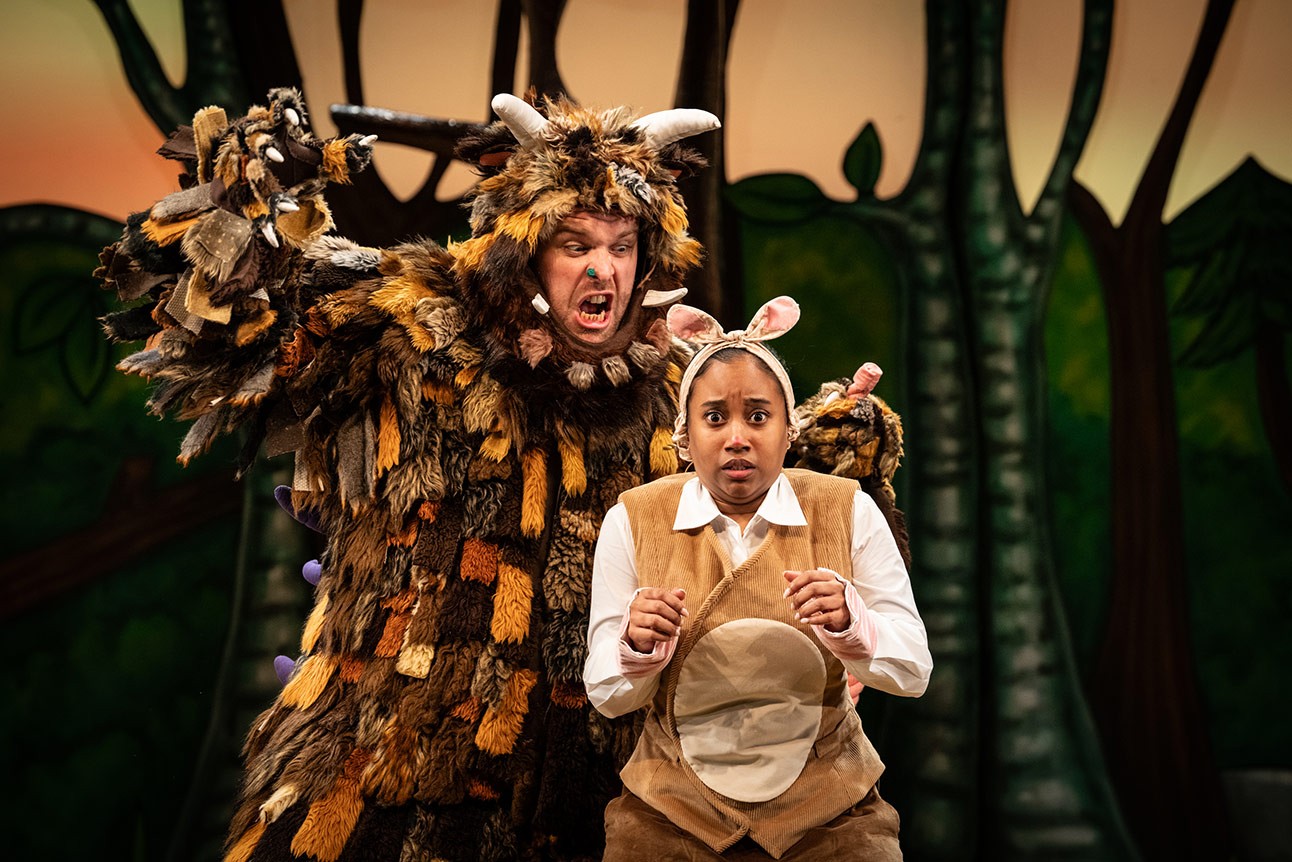 Niall Hemingway and Rianna Kellman in Gruffalo costumes on stage, forest backdrop.