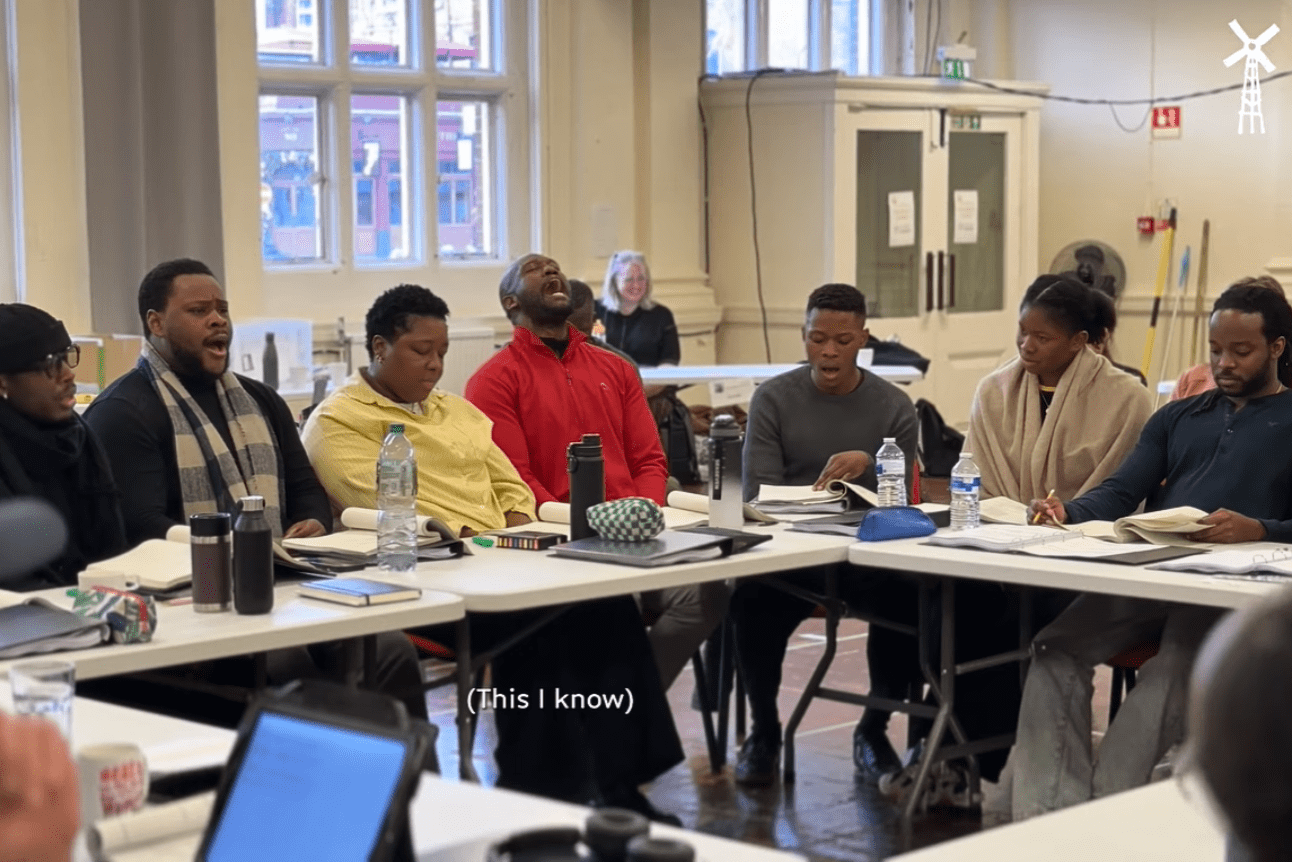 Cast of The Boy Who Harnessed The Wind singing in the rehearsal room.