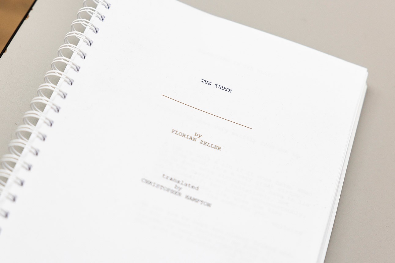 Spiral-bound script titled "THE TRUTH" by Florian Zeller on a white surface.