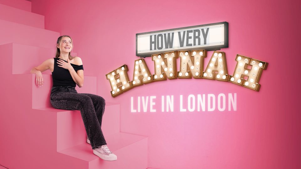 Hannah Lowther in black outfit sits on pink steps; text reads "How Very Hannah Live in London.