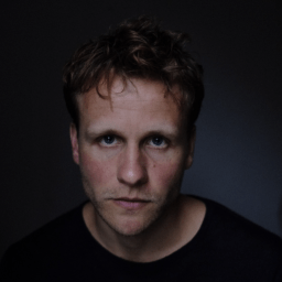 Josh Dylan on a dark backround.