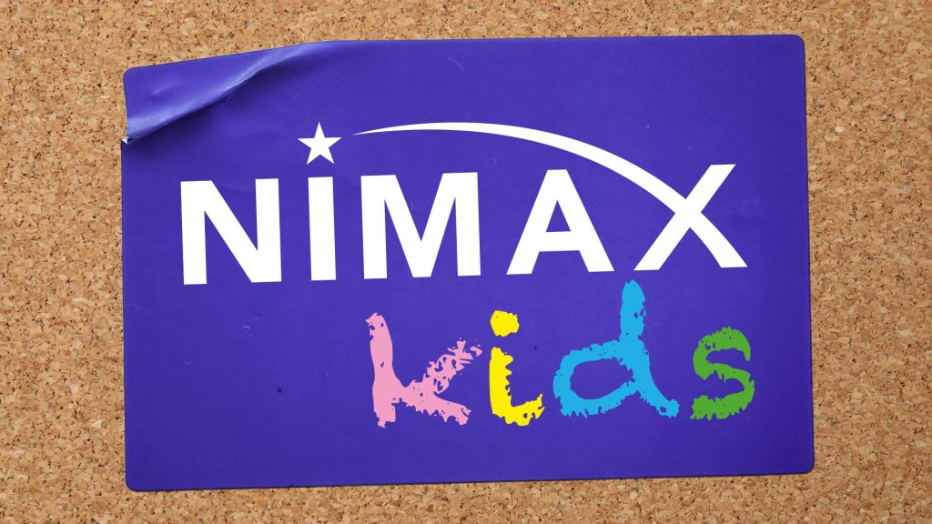 Nimax Kids logo with colourful text on a purple background, pinned to a corkboard.